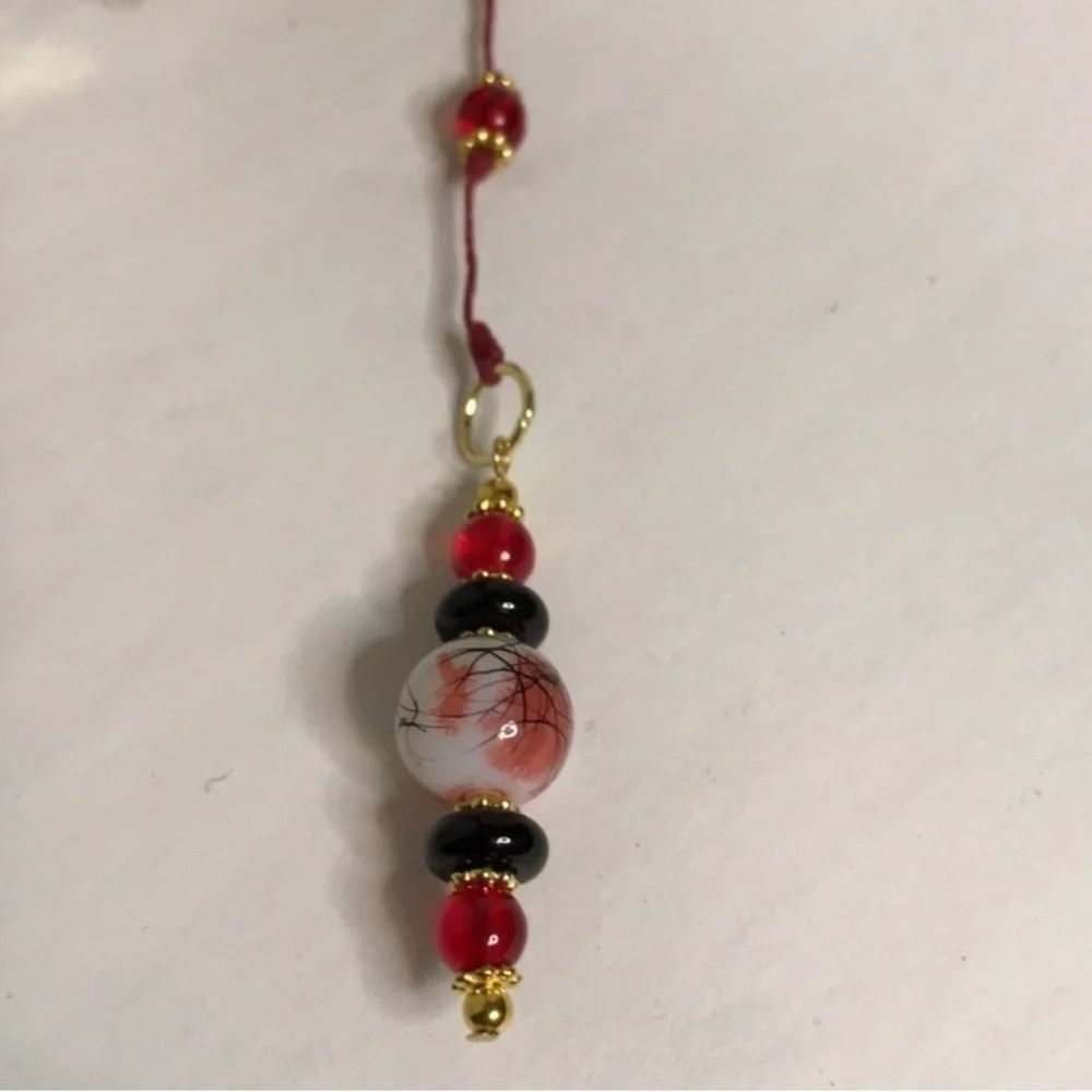ECCENTRIC HANDCRAFTED Red/White/Black Beaded Bookmark with Golden Cross